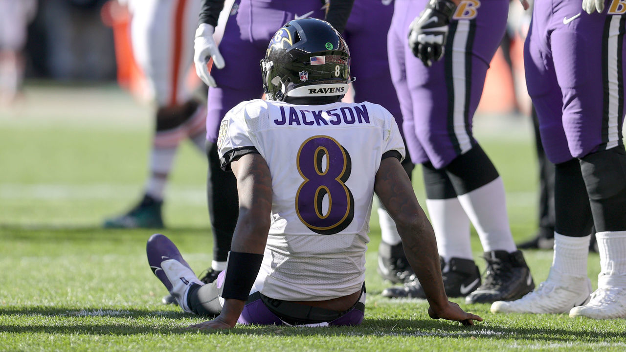 CLEVELAND, OH - DECEMBER 12: Baltimore Ravens quarterback Lamar Jackson (8) sits on the turf after injuring his ankle during the second quarter of the National Football League game between the Baltimore Ravens and Cleveland Browns on December 12, 2021, at FirstEnergy Stadium in Cleveland, OH.