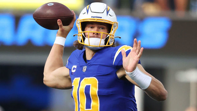 INGLEWOOD, CALIFORNIA - DECEMBER 12: Justin Herbert #10 of the Los Angeles Chargers throws the ball during the second quarter against the New York Giants at SoFi Stadium on December 12, 2021 in Inglewood, California.