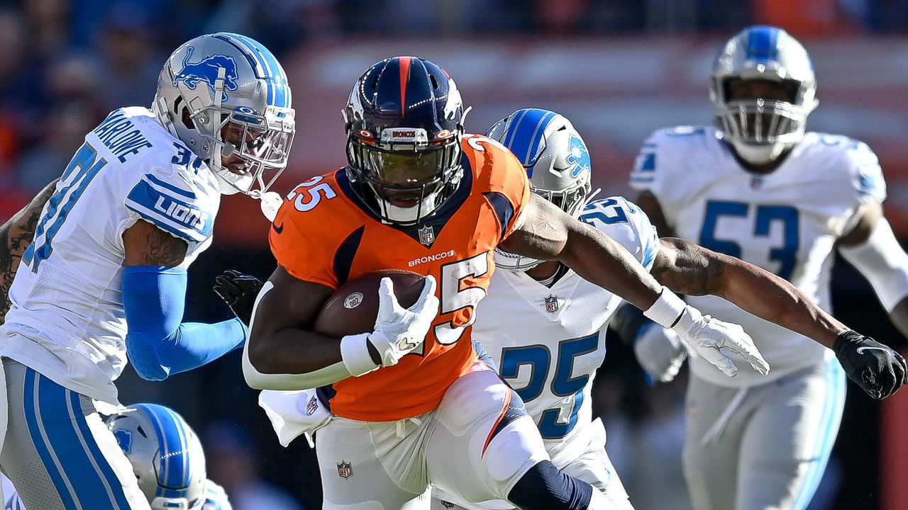 DENVER, CO - DECEMBER 12: Denver Broncos running back Melvin Gordon (25) carries the ball during a game between the Denver Broncos and the Detroit Lions at Empower Field at Mile High on December 12, 2021 in Denver, Colorado.