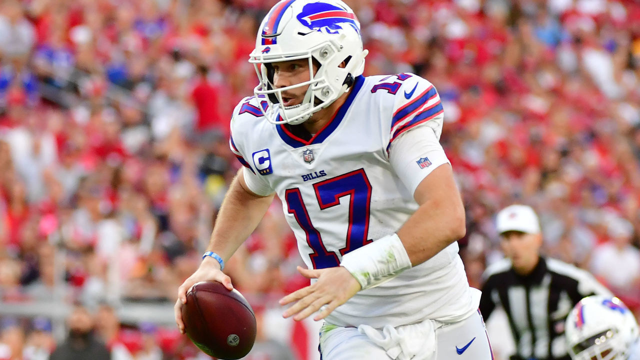 TAMPA, FLORIDA - DECEMBER 12: Josh Allen #17 of the Buffalo Bills runs with the ball against the Tampa Bay Buccaneers during the first half at Raymond James Stadium on December 12, 2021 in Tampa, Florida.