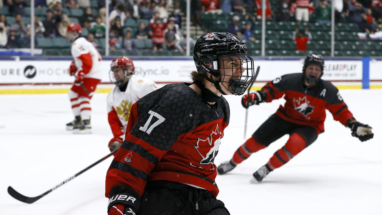 FRISCO, TEXAS - MAY 06: Connor Bedard #17 of Canada reacts after scoring a goal against Sergei Ivanov #29 of Russia in the first period during the 2021 IIHF Ice Hockey U18 World Championship Gold Medal Game at Comerica Center on May 06, 2021 in Frisco, Texas.