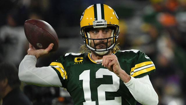 GREEN BAY, WISCONSIN - DECEMBER 12: Aaron Rodgers #12 of the Green Bay Packers warms up before the NFL game against the Chicago Bears at Lambeau Field on December 12, 2021 in Green Bay, Wisconsin.