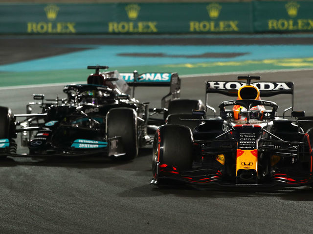 ABU DHABI, UNITED ARAB EMIRATES - DECEMBER 12: Max Verstappen of the Netherlands driving the (33) Red Bull Racing RB16B Honda leads Lewis Hamilton of Great Britain driving the (44) Mercedes AMG Petronas F1 Team Mercedes W12 during the F1 Grand Prix of Abu Dhabi at Yas Marina Circuit on December 12, 2021 in Abu Dhabi, United Arab Emirates.