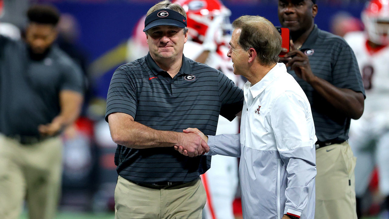 ATLANTA, GEORGIA - DECEMBER 04: Head Coach Nick Saban of the Alabama Crimson Tide talks with Head Coach Kirby Smart of the Georgia Bulldogs before the SEC Championship game at Mercedes-Benz Stadium on December 04, 2021 in Atlanta, Georgia.