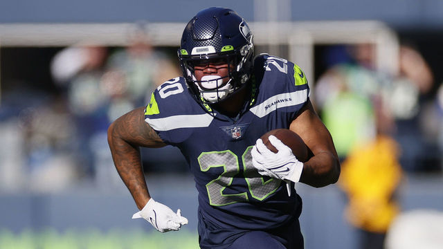 SEATTLE, WASHINGTON - OCTOBER 31: Rashaad Penny #20 of the Seattle Seahawks carries the ball against the Jacksonville Jaguars during the first quarter at Lumen Field on October 31, 2021 in Seattle, Washington.