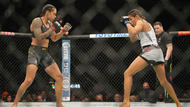 LAS VEGAS, NV - DECEMBER 11: (L-R) Amanda Nunes battles Julianna Peña in their womans bantamweight title fight during the UFC 269 on December 11, 2021, at T-Mobile Arena in Las Vegas, NV.
