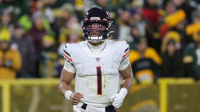 GREEN BAY, WISCONSIN - DECEMBER 12: Justin Fields #1 of the Chicago Bears runs to the sideline during a game against the Green Bay Packers at Lambeau Field on December 12, 2021 in Green Bay, Wisconsin. The Packers defeated the Bears 45-30.