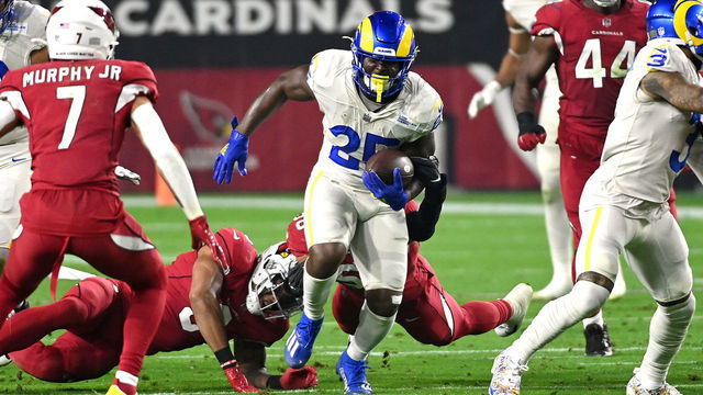 GLENDALE, ARIZONA - DECEMBER 13: Sony Michel #25 of the Los Angeles Rams rushes the ball in the first quarter of the game against the Los Angeles Rams at State Farm Stadium on December 13, 2021 in Glendale, Arizona.
