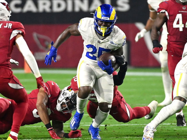 GLENDALE, ARIZONA - DECEMBER 13: Sony Michel #25 of the Los Angeles Rams rushes the ball in the first quarter of the game against the Los Angeles Rams at State Farm Stadium on December 13, 2021 in Glendale, Arizona.