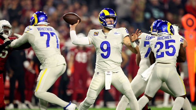 GLENDALE, ARIZONA - DECEMBER 13: Matthew Stafford #9 of the Los Angeles Rams throws the ball in the first quarter of the game against the Arizona Cardinals at State Farm Stadium on December 13, 2021 in Glendale, Arizona.