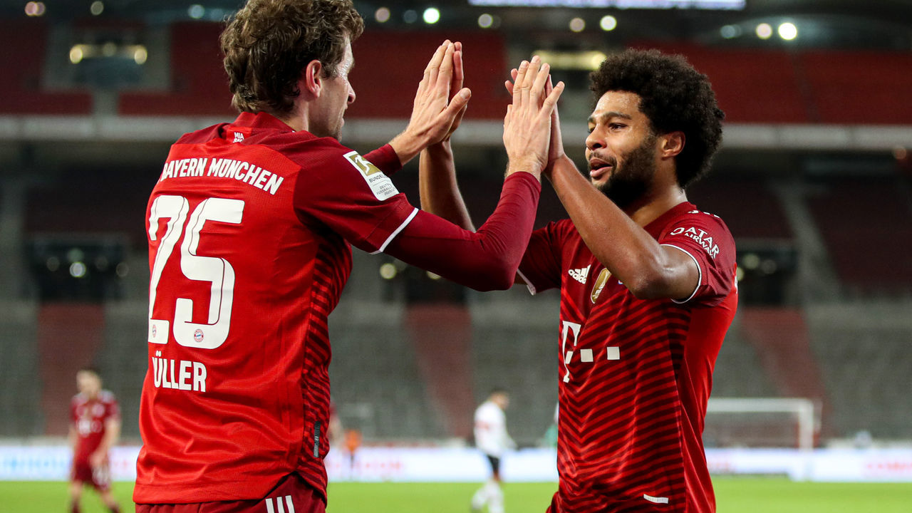 14 December 2021, Baden-Wuerttemberg, Stuttgart: Football: Bundesliga, VfB Stuttgart - Bayern Munich, Matchday 16, at Mercedes-Benz Arena. Munich's Thomas Müller () and Munich's Serge Gnabry celebrate Gnabry's goal to make it 0:5. IMPORTANT NOTICE: In accordance with the requirements of the DFL Deutsche Fußball Liga and/or the DFB Deutscher Fußball-Bund, it is prohibited to exploit or have exploited photographs taken in the stadium and/or of the match in the form of sequence pictures and/or video-like photo series. Photo: Tom Weller/dpa
