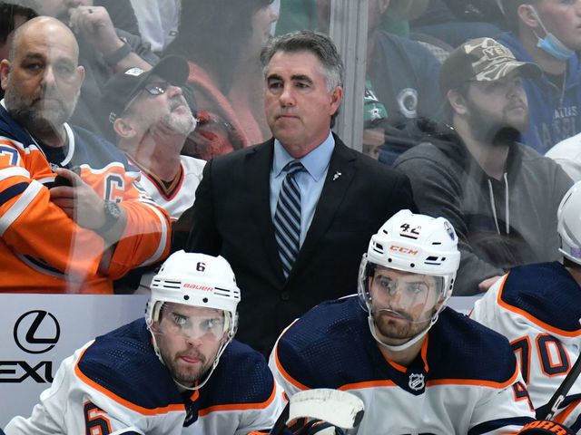 DALLAS, TX - NOVEMBER 23: Dave Tippett of the Edmonton Oilers watches the action from behind the bench against the Dallas Stars at the American Airlines Center on November 23, 2021 in Dallas, Texas.