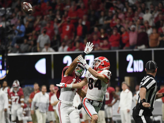 ATLANTA, GA - DECEMBER 04: Alabama Crimson Tide Defensive Back Kool-Aid McKinstry (1) defends Georgia Bulldogs Wide Receiver Ladd McConkey (84) during the SEC Championship game between the Alabama Crimson Tide and the Georgia Bulldogs on December 04, 2021, at Mercedes-Benz Stadium in Atlanta, Ga.