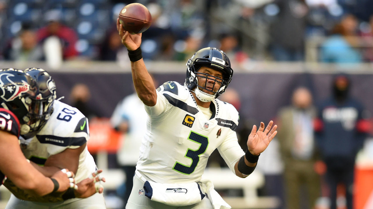 HOUSTON, TX - DECEMBER 12: Seattle Seahawks QB Russell Wilson throws a pass during game featuring the Houston Texans and the Seattle Seahawks on December 12, 2021 at NRG Stadium in Houston, TX.
