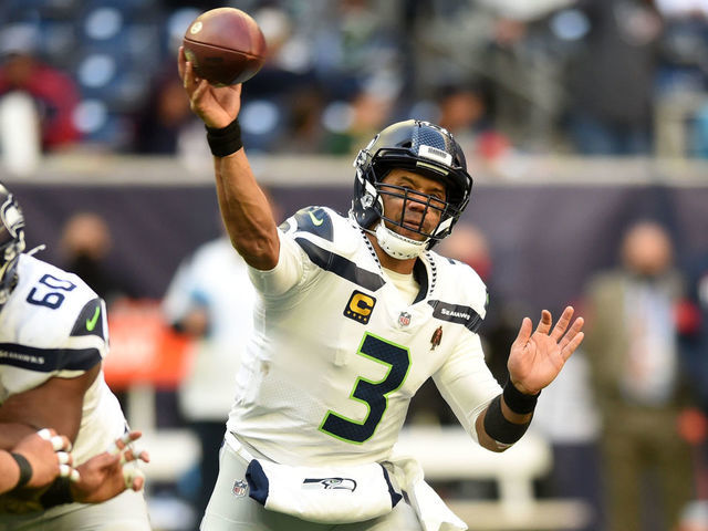 HOUSTON, TX - DECEMBER 12: Seattle Seahawks QB Russell Wilson throws a pass during game featuring the Houston Texans and the Seattle Seahawks on December 12, 2021 at NRG Stadium in Houston, TX.