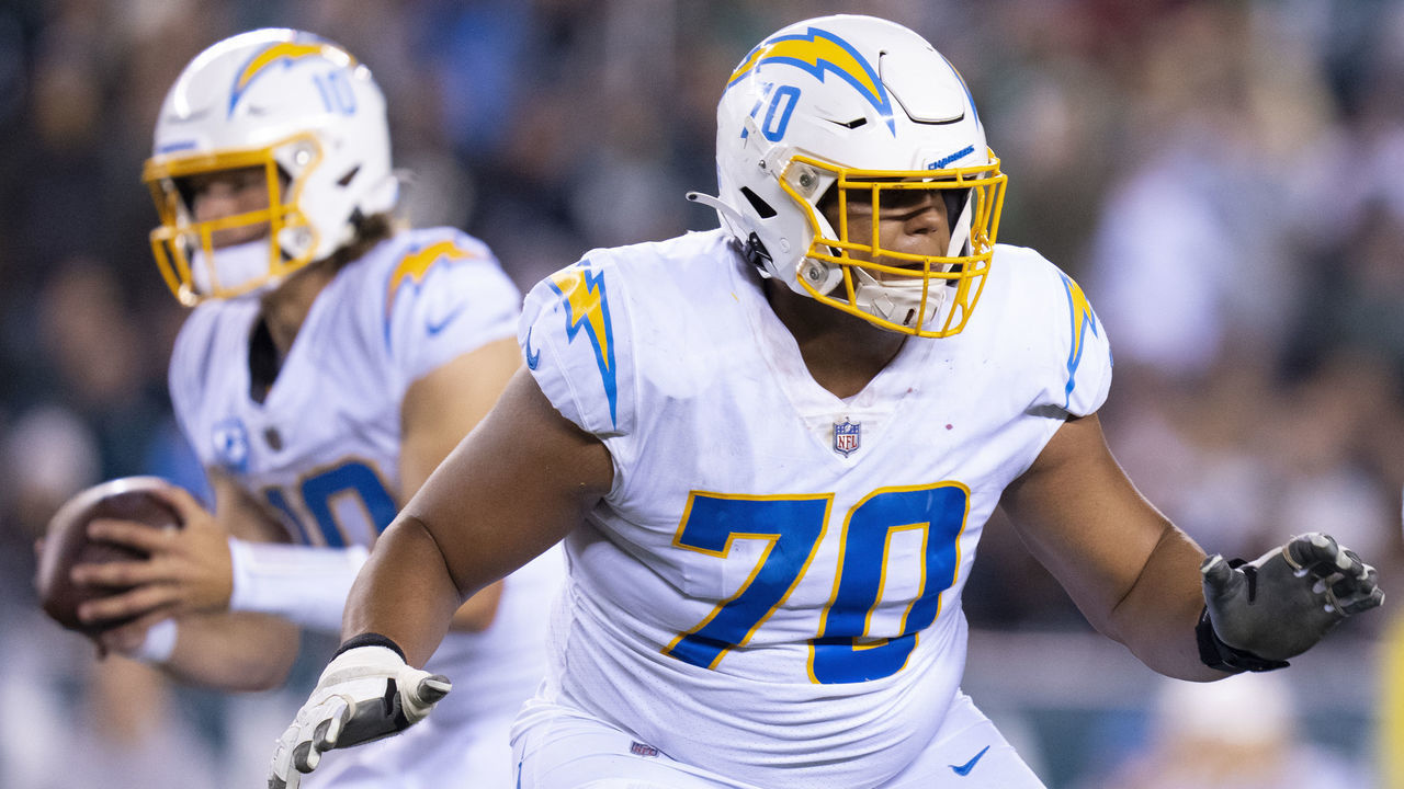 PHILADELPHIA, PA - NOVEMBER 07: Rashawn Slater #70 of the Los Angeles Chargers blocks for Justin Herbert #10 against the Philadelphia Eagles at Lincoln Financial Field on November 7, 2021 in Philadelphia, Pennsylvania.