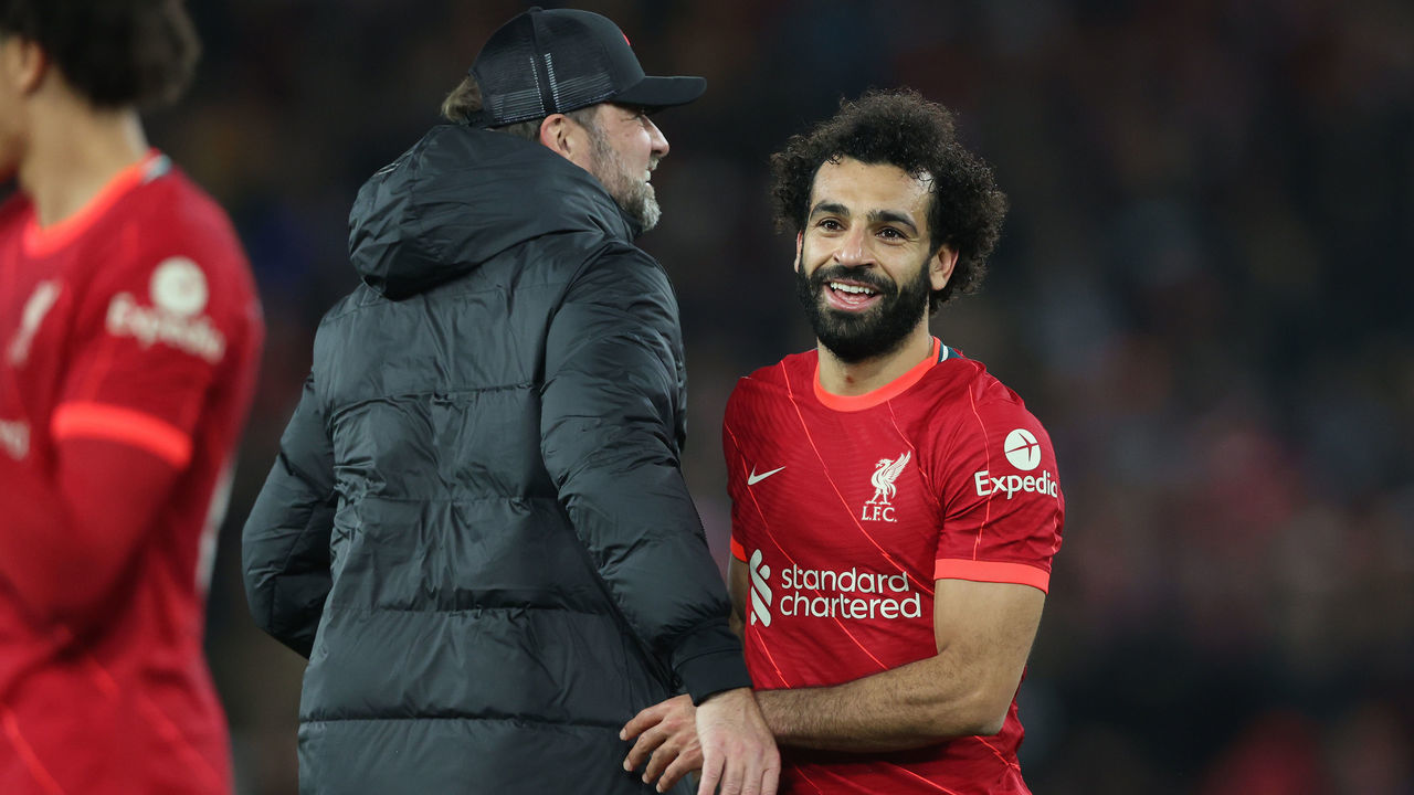 LIVERPOOL, ENGLAND - NOVEMBER 20: Mohamed Salah embraces Juergen Klopp, Manager of Liverpool after their sides victory in the Premier League match between Liverpool and Arsenal at Anfield on November 20, 2021 in Liverpool, England.