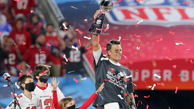 TAMPA, FL - FEBRUARY 07: Super Bowl MVP Tom Brady (12) of the Buccaneers holds the Lombardi Trophy as he is surrounded by his kids Benjamin Brady, John Edward Thomas Moynahan and Vivian Lake Brady after the Super Bowl LV game between the Kansas City Chiefs and the Tampa Bay Buccaneers on February 7, 2021 at Raymond James Stadium, in Tampa, FL.