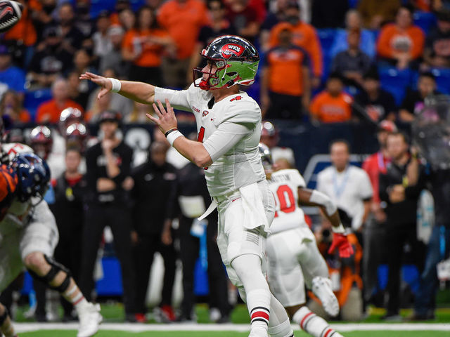 SAN ANTONIO, TX - DECEMBER 03: Western Kentucky Hilltoppers quarterback Bailey Zappe (4) throws downfield during the football game between the Western Kentucky Hilltoppers and UTSA Roadrunners at the Alamodome on December 3, 2021 in San Antonio, Texas.