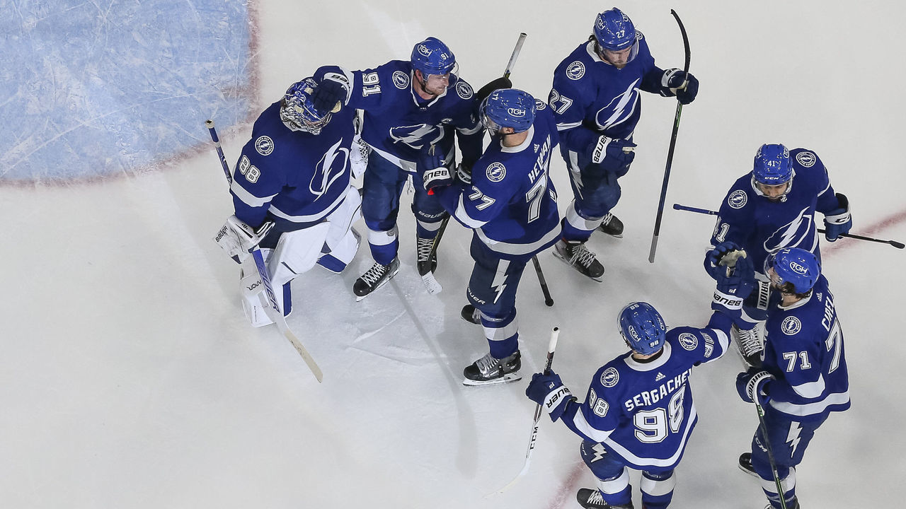 TAMPA, FL - DECEMBER 16: Goalie Andrei Vasilevskiy #88, Steven Stamkos #91, and Victor Hedman #77 of the Tampa Bay Lightning celebrate the win against the Ottawa Senators at Amalie Arena on December 16, 2021 in Tampa, Florida.