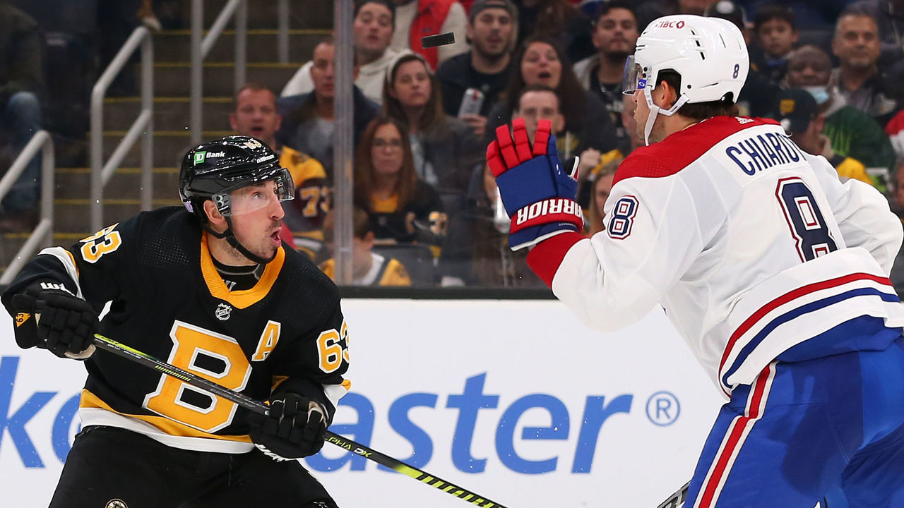 BOSTON, MA - NOVEMBER 14: Boston Bruins left wing Brad Marchand (63) and Montreal Canadiens defenseman Ben Chiarot (8) watch the flight of the puck during a NHL game between Montreal Canadiens and Boston Bruins on November 14, 2021, at TD Garden in Boston, MA.