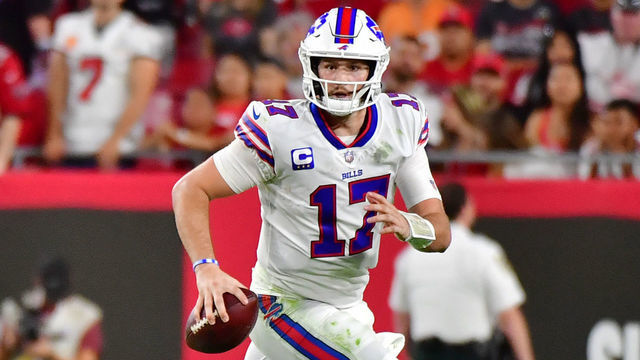 TAMPA, FLORIDA - DECEMBER 12: Josh Allen #17 of the Buffalo Bills runs with the ball during the first half against the Tampa Bay Buccaneers at Raymond James Stadium on December 12, 2021 in Tampa, Florida.