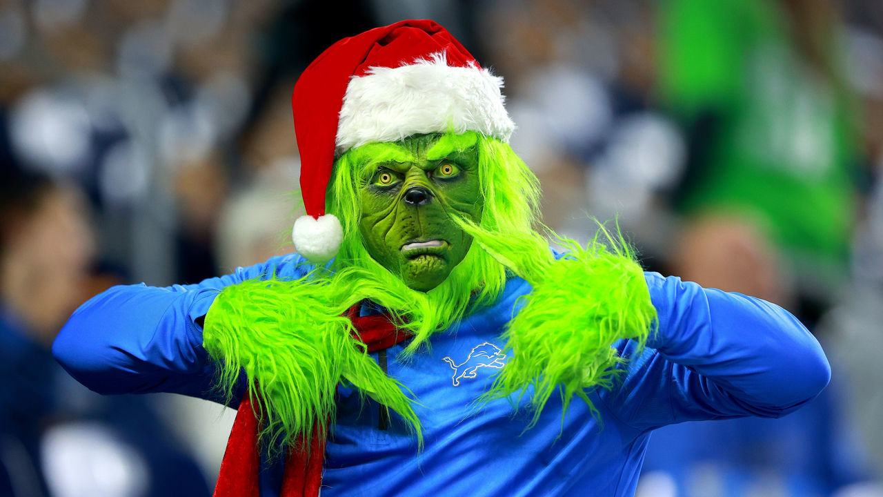 DETROIT, MICHIGAN - OCTOBER 31: A Detroit Lions fan dressed as the grinch in the stands before the game against the Philadelphia Eagles at Ford Field on October 31, 2021 in Detroit, Michigan.