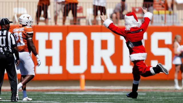 AUSTIN, TEXAS - SEPTEMBER 25: A fan runs onto the field dressed as Santa Claus in the fourth quarter of the game between the Texas Longhorns and the Texas Tech Red Raiders at Darrell K Royal-Texas Memorial Stadium on September 25, 2021 in Austin, Texas.