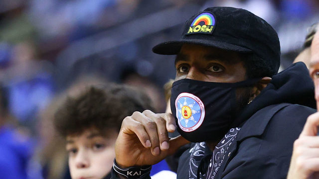 NEWARK, NJ - DECEMBER 01: Brooklyn Nets' Kyrie Irving watches the action during the second half of the college basketball game between the Seton Hall Pirates and the Wagner Seahawks on December 1, 2021 at the Prudential Center in Newrk, NJ.