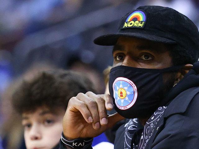 NEWARK, NJ - DECEMBER 01: Brooklyn Nets' Kyrie Irving watches the action during the second half of the college basketball game between the Seton Hall Pirates and the Wagner Seahawks on December 1, 2021 at the Prudential Center in Newrk, NJ.