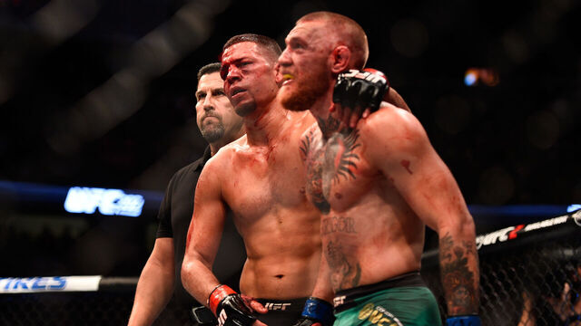 LAS VEGAS, NV - AUGUST 20: (L-R) Nate Diaz and Conor McGregor of Ireland embrace after finishing five rounds in their welterweight bout during the UFC 202 event at T-Mobile Arena on August 20, 2016 in Las Vegas, Nevada.
