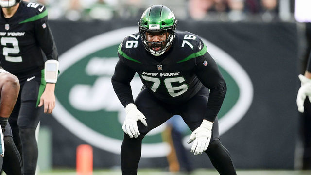 EAST RUTHERFORD, NEW JERSEY - DECEMBER 05: George Fant #76 of the New York Jets lines up against the Philadelphia Eagles at MetLife Stadium on December 05, 2021 in East Rutherford, New Jersey.