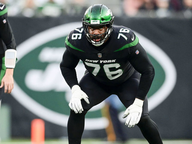 EAST RUTHERFORD, NEW JERSEY - DECEMBER 05: George Fant #76 of the New York Jets lines up against the Philadelphia Eagles at MetLife Stadium on December 05, 2021 in East Rutherford, New Jersey.
