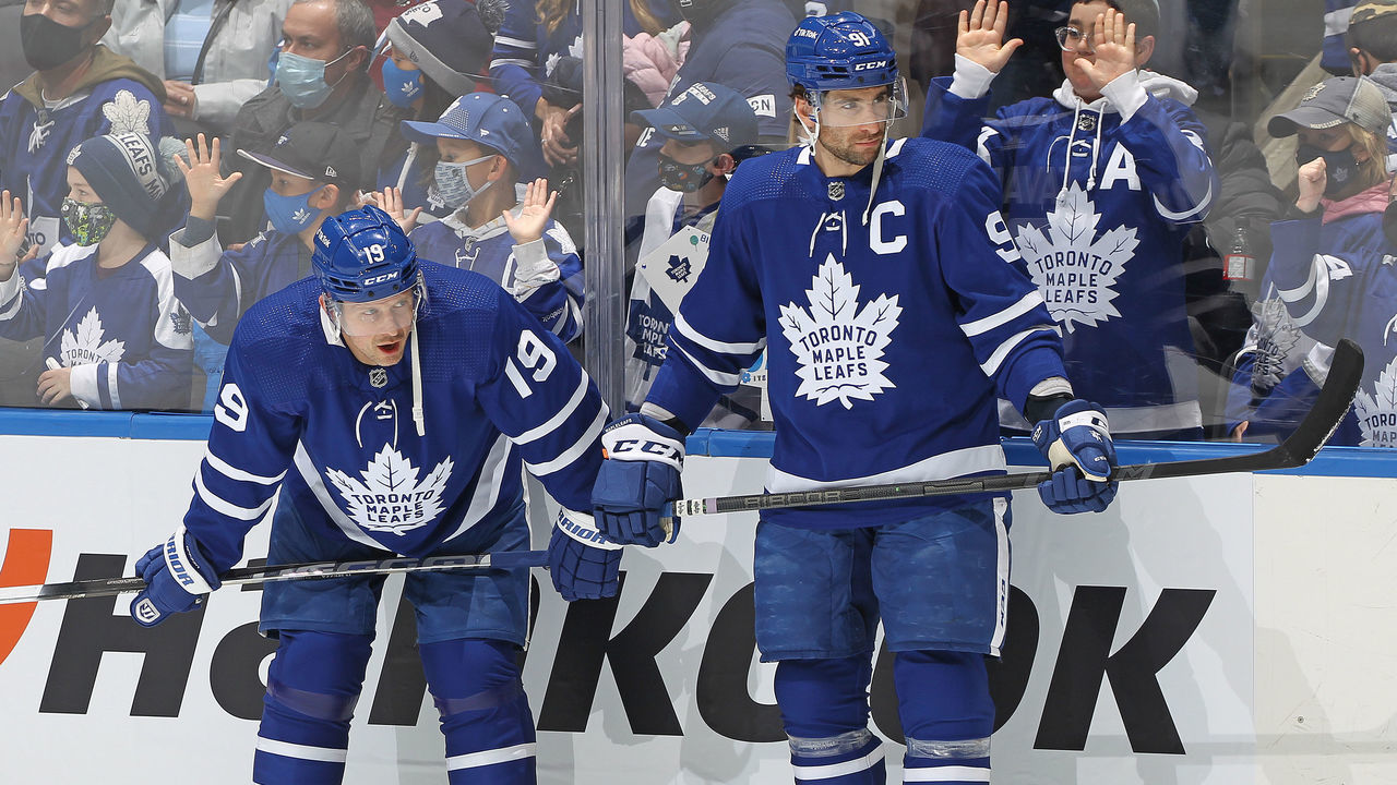 TORONTO, ON - DECEMBER 1: Jason Spezza #19 and John Tavares #91 of the Toronto Maple Leafs chat during warm-up prior to action against the Colorado Avalanche in an NHL game at Scotiabank Arena on December 1, 2021 in Toronto, Ontario, Canada.