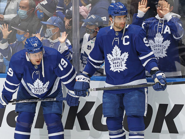 TORONTO, ON - DECEMBER 1: Jason Spezza #19 and John Tavares #91 of the Toronto Maple Leafs chat during warm-up prior to action against the Colorado Avalanche in an NHL game at Scotiabank Arena on December 1, 2021 in Toronto, Ontario, Canada.