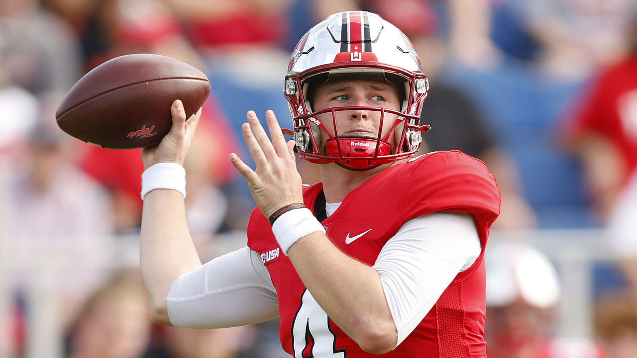 BOCA RATON, FLORIDA - DECEMBER 18: Bailey Zappe #4 of the Western Kentucky Hilltoppers throws a pass against the Appalachian State Mountaineers during the first half of the RoofClaim.com Boca Raton Bowl at FAU Stadium on December 18, 2021 in Boca Raton, Florida.