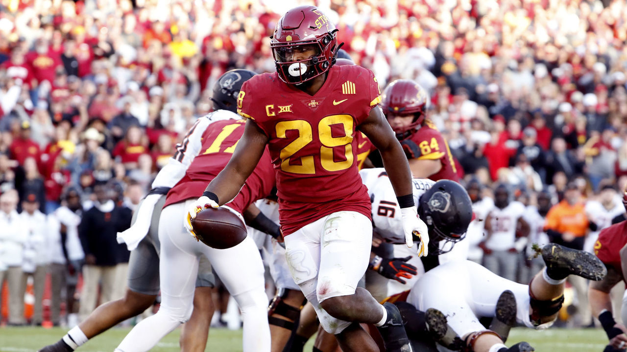 AMES, IA - OCTOBER 23: Running back Breece Hall #28 of the Iowa State Cyclones drives the ball into the end zone for a touchdown in the second half of play against the Oklahoma State Cowboys at Jack Trice Stadium on October 23, 2021 in Ames, Iowa. The Iowa State Cyclones Womacks 24-21 over the Oklahoma State Cowboys.