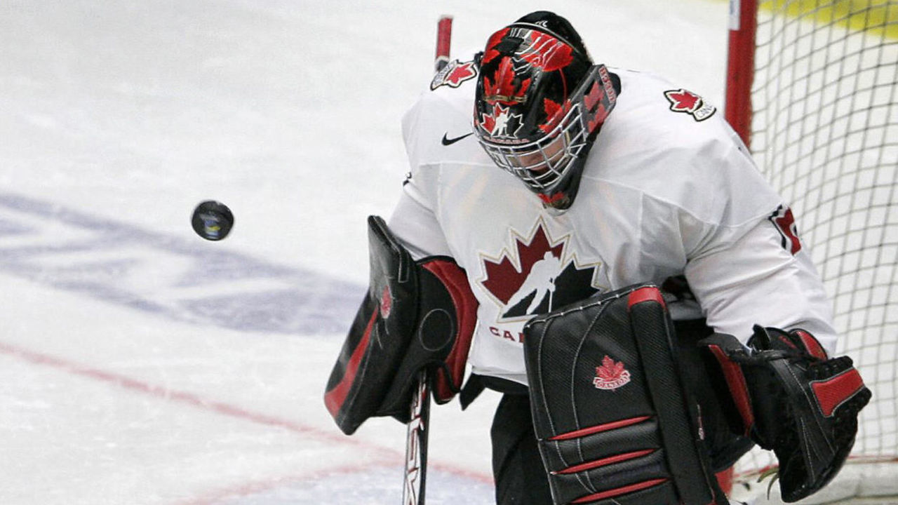 Leksand, SWEDEN: Team Canada's goalie Carey Price saves the last shot from Team USA's Peter Mueller (88) in the penalty shootout during the semifinal match USA vs Canada at the World U20 hockey championship 03 January 2007 in Leksand, Sweden. Canada won 2-3 and meets Sweden or Russia in final 05 January 2007. AFP PHOTO/SCANPIX/ANDERS WIKLUND