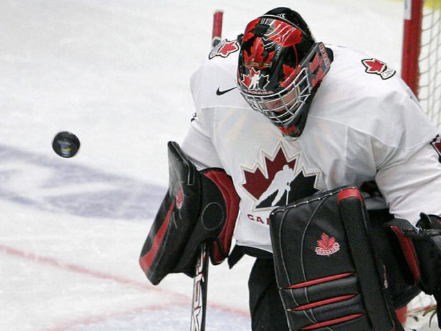 Leksand, SWEDEN: Team Canada's goalie Carey Price saves the last shot from Team USA's Peter Mueller (88) in the penalty shootout during the semifinal match USA vs Canada at the World U20 hockey championship 03 January 2007 in Leksand, Sweden. Canada won 2-3 and meets Sweden or Russia in final 05 January 2007. AFP PHOTO/SCANPIX/ANDERS WIKLUND