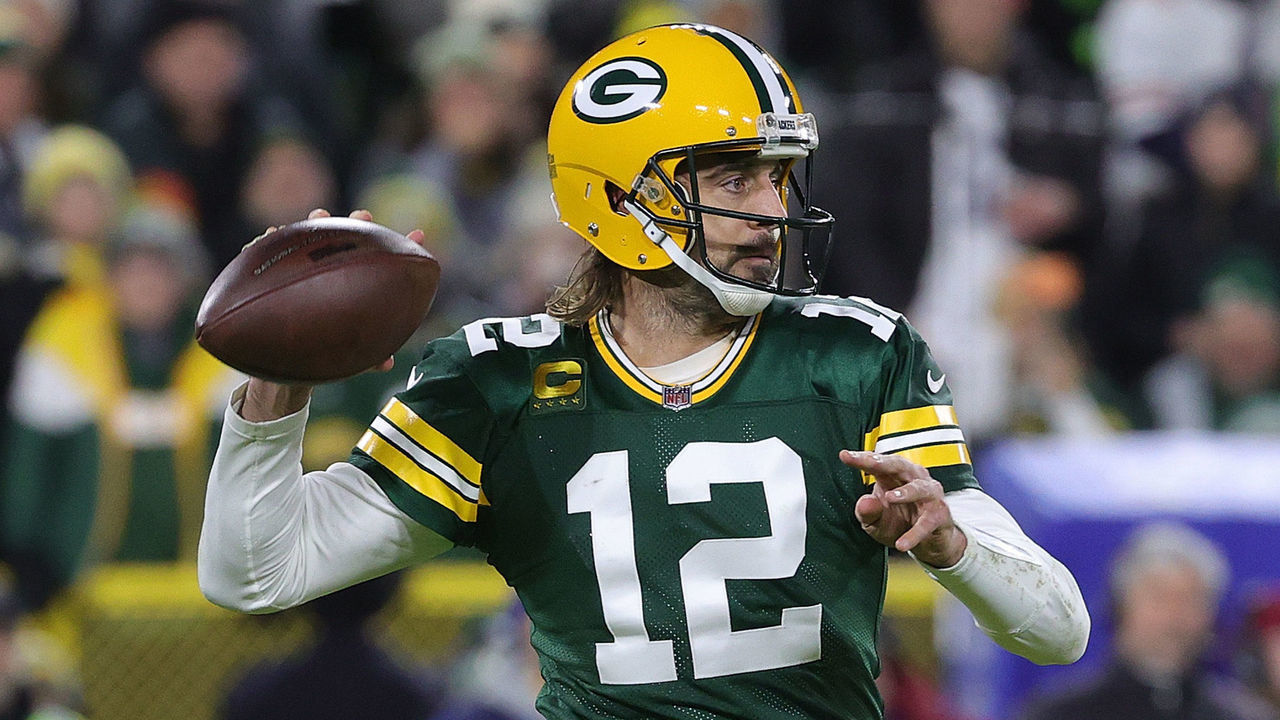 GREEN BAY, WISCONSIN - DECEMBER 12: Aaron Rodgers #12 of the Green Bay Packers drops back to pass during a game against the Chicago Bears at Lambeau Field on December 12, 2021 in Green Bay, Wisconsin. The Packers defeated the Bears 45-30.
