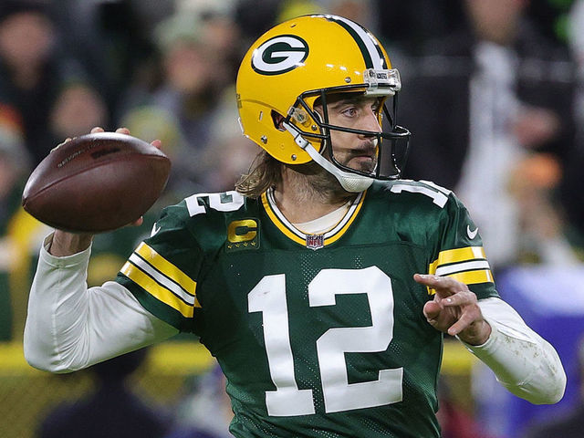 GREEN BAY, WISCONSIN - DECEMBER 12: Aaron Rodgers #12 of the Green Bay Packers drops back to pass during a game against the Chicago Bears at Lambeau Field on December 12, 2021 in Green Bay, Wisconsin. The Packers defeated the Bears 45-30.