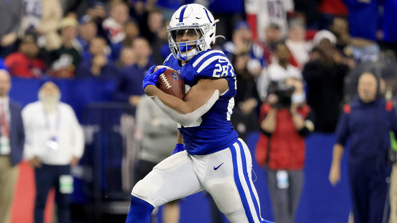 INDIANAPOLIS, INDIANA - DECEMBER 18: Jonathan Taylor #28 of the Indianapolis Colts rushes for a touchdown during the fourth quarter against the New England Patriots at Lucas Oil Stadium on December 18, 2021 in Indianapolis, Indiana.