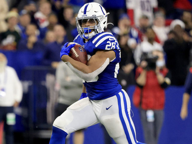 INDIANAPOLIS, INDIANA - DECEMBER 18: Jonathan Taylor #28 of the Indianapolis Colts rushes for a touchdown during the fourth quarter against the New England Patriots at Lucas Oil Stadium on December 18, 2021 in Indianapolis, Indiana.