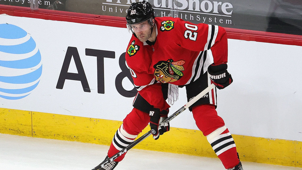 CHICAGO, ILLINOIS - APRIL 23: Brett Connolly #20 of the Chicago Blackhawks looks to pass against the Nashville Predators at the United Center on April 23, 2021 in Chicago, Illinois. The Predators defeated the Blackhawks 3-1.