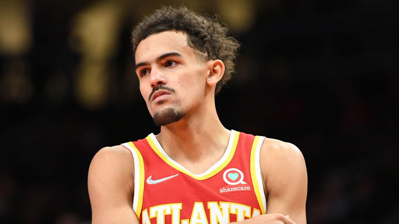 ATLANTA, GA - DECEMBER 13: Trae Young #11 of the Atlanta Hawks looks on during the game against the Houston Rockets on December 13, 2021 at State Farm Arena in Atlanta, Georgia. NOTE TO USER: User expressly acknowledges and agrees that, by downloading and/or using this Photograph, user is consenting to the terms and conditions of the Getty Images License Agreement. Mandatory Copyright Notice: Copyright 2021 NBAE
