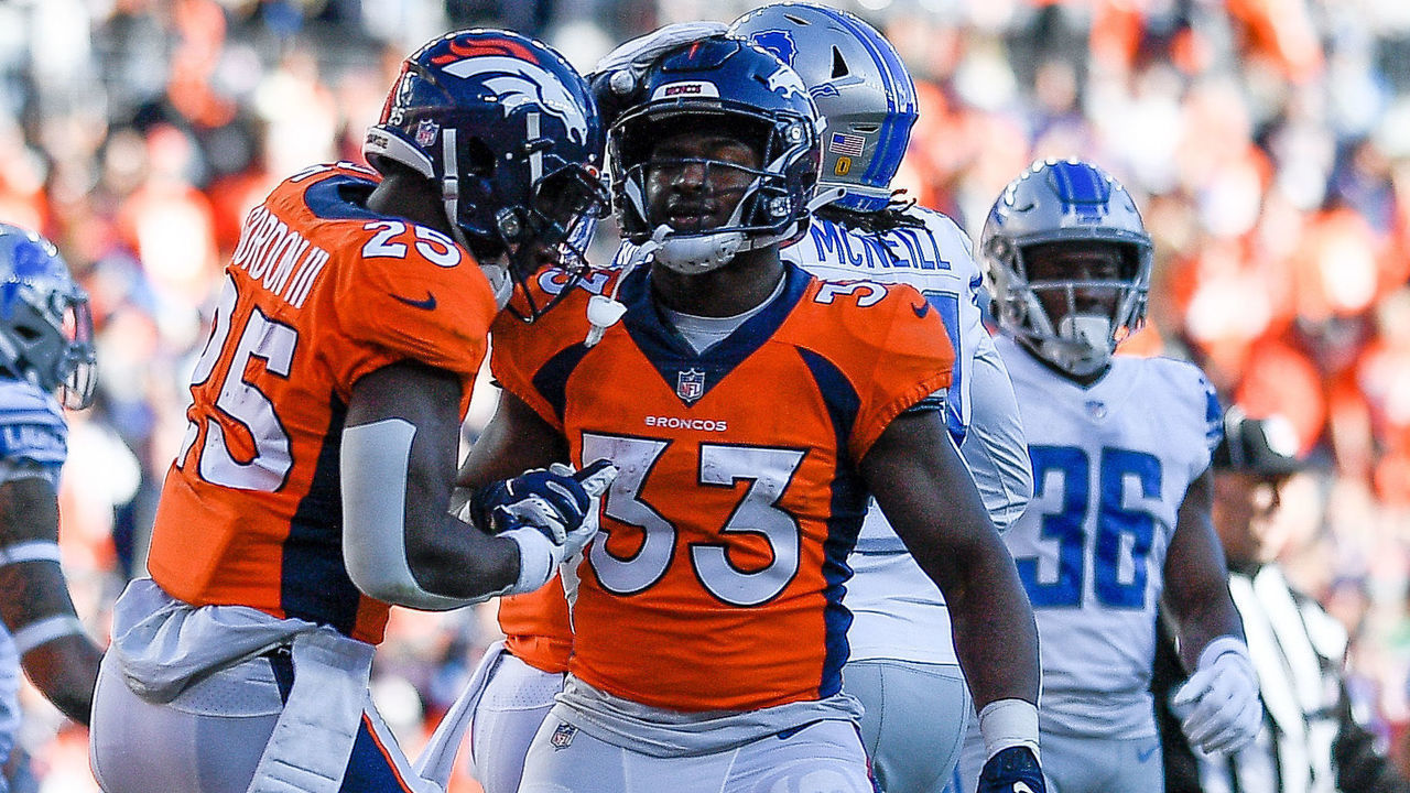 DENVER, CO - DECEMBER 12: Denver Broncos running back Melvin Gordon (25) celebrates with running back Javonte Williams (33) after a first quarter Gordon touchdown during a game between the Denver Broncos and the Detroit Lions at Empower Field at Mile High on December 12, 2021 in Denver, Colorado.