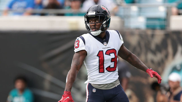 JACKSONVILLE, FLORIDA - DECEMBER 19: Brandin Cooks #13 of the Houston Texans reacts after scoring a touchdown during the first quarter against the Jacksonville Jaguars at TIAA Bank Field on December 19, 2021 in Jacksonville, Florida.