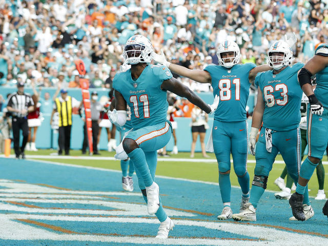 The Miami Dolphins celebrate after scoring a touchdown during the News  Photo - Getty Images