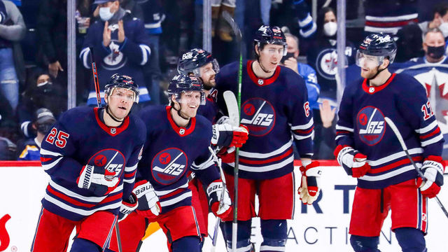 WINNIPEG, MB - DECEMBER 19: Paul Stastny #25, Nikolaj Ehlers #27 Josh Morrissey #44, Logan Stanley #64 and Adam Lowry #17 of the Winnipeg Jets celebrate a third period goal against the St. Louis Blues at the Canada Life Centre on December 19, 2021 in Winnipeg, Manitoba, Canada.
