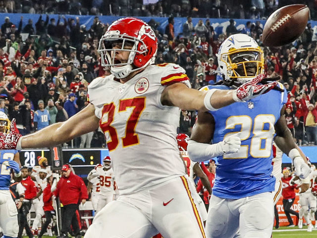 Inglewood, CA, Thursday, December 16, 2021 - Kansas City Chiefs tight end Travis Kelce (87) scores the game winning touchdown in overtime past Los Angeles Chargers cornerback Davontae Harris (28) at SoFi Stadium. (Robert Gauthier/Los Angeles Times via Getty Images)